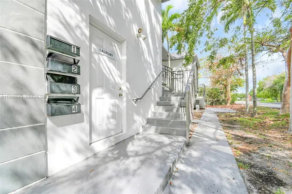 a view of a house with a tree