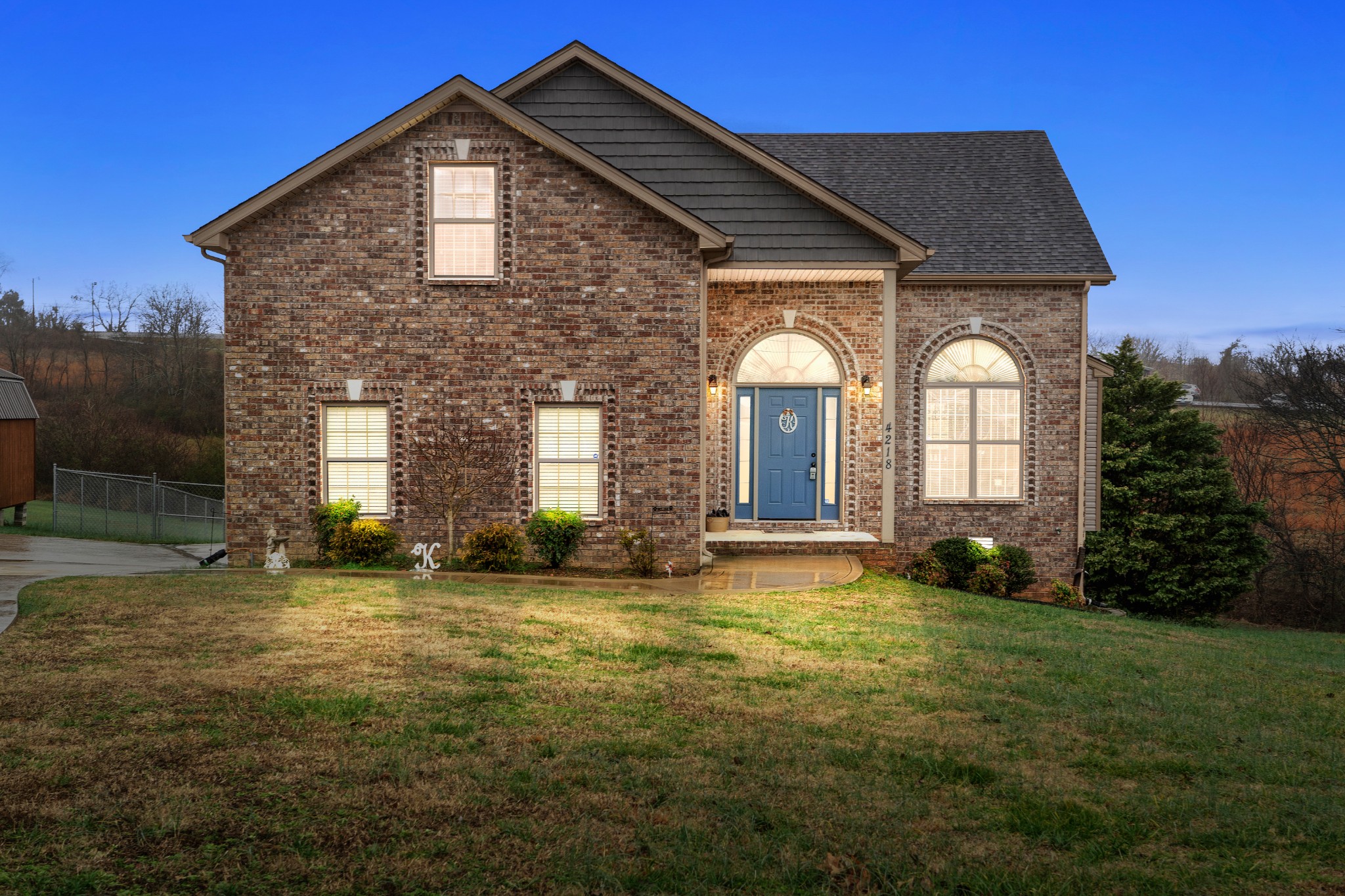 a front view of a house with a yard