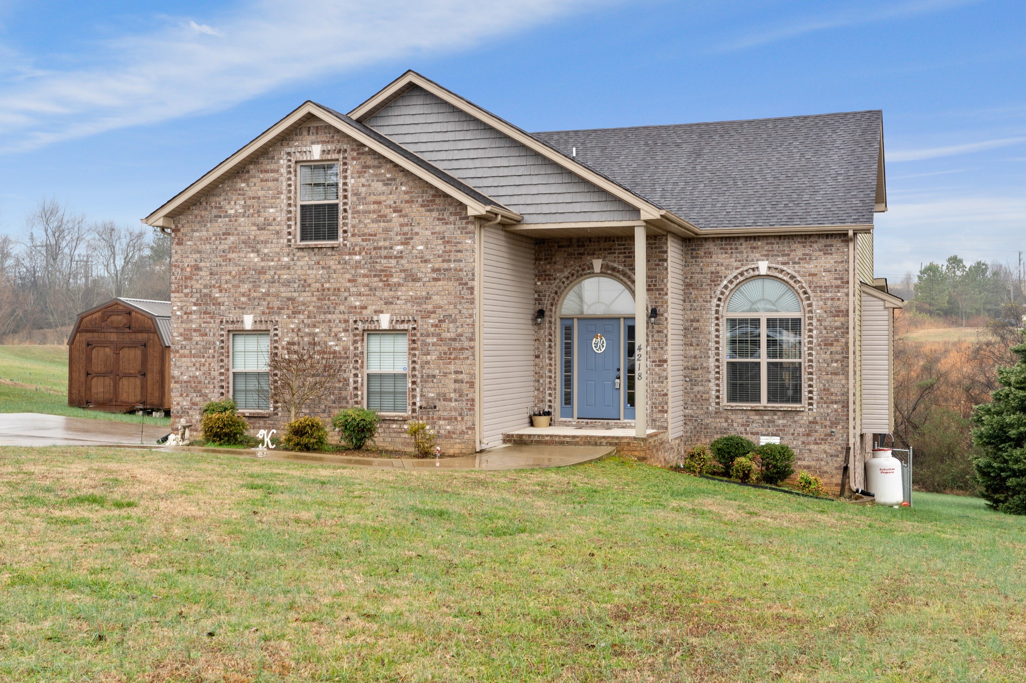 4218 Station Road Cunningham, TN 37052 - Photo 2 of 32 a front view of a house with garden
