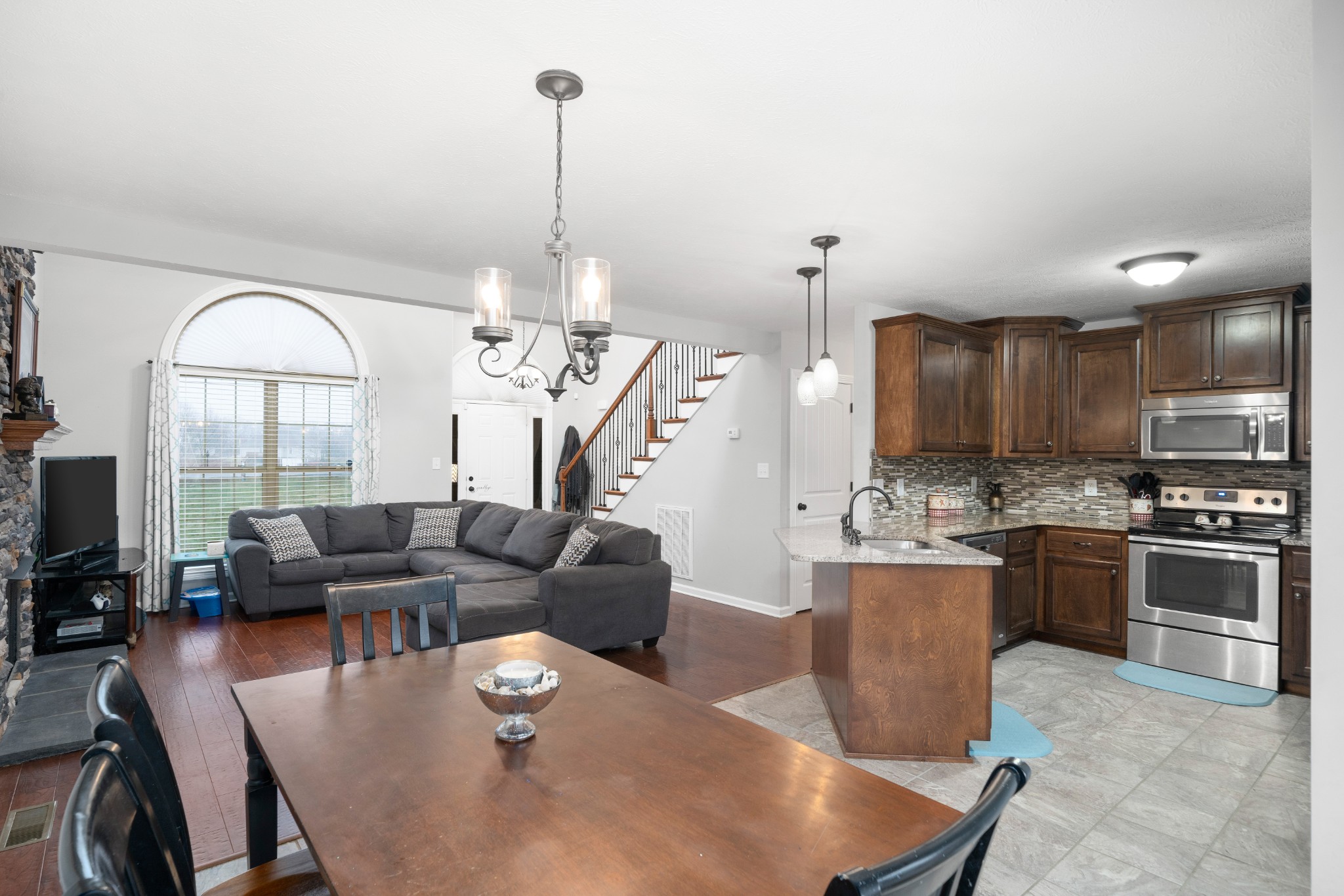 4218 Station Road Cunningham, TN 37052 - Photo 11 of 32 a living room with furniture kitchen view and a chandelier
