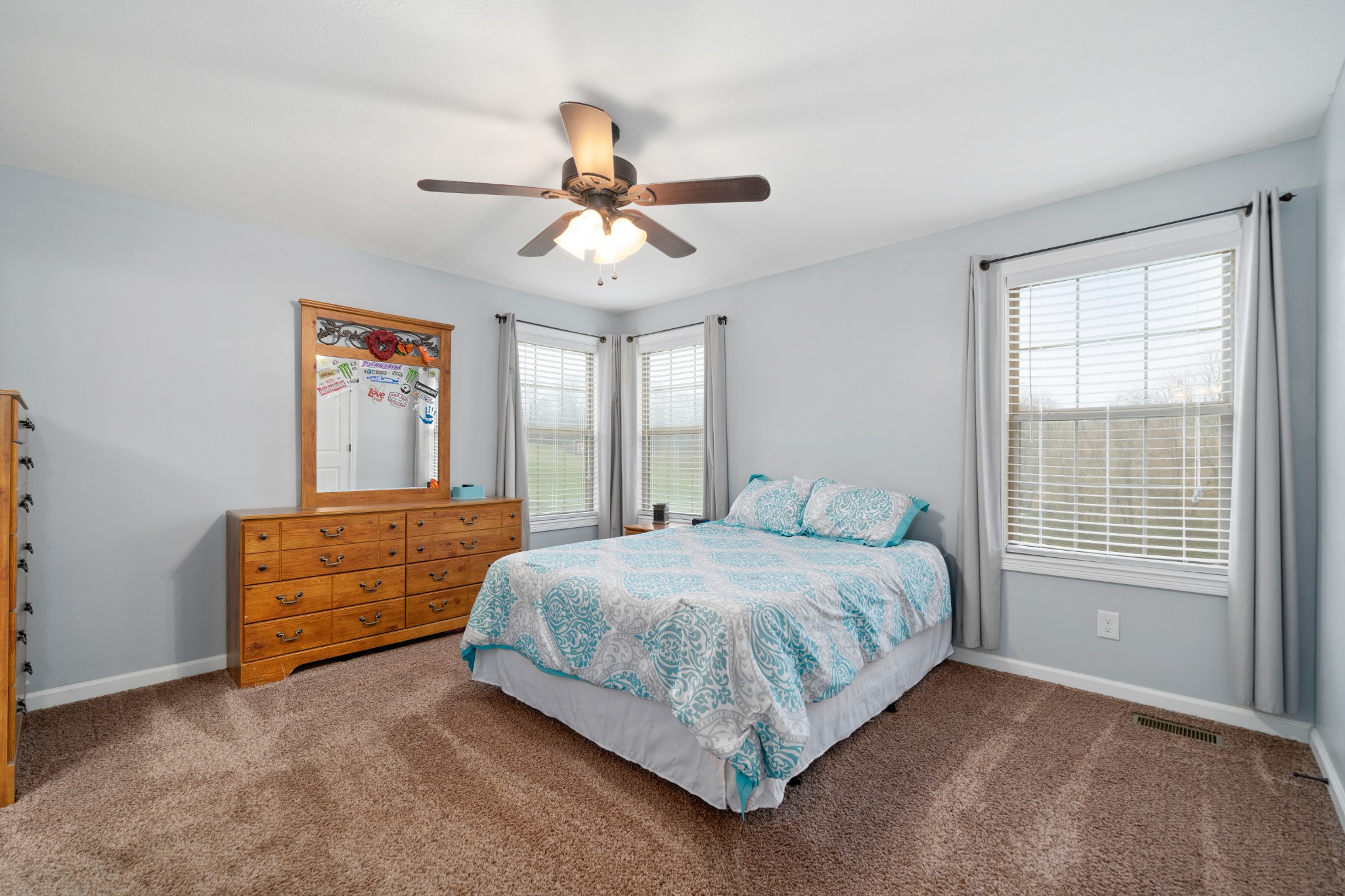 4218 Station Road Cunningham, TN 37052 - Photo 17 of 32 a bedroom with a bed and a chandelier