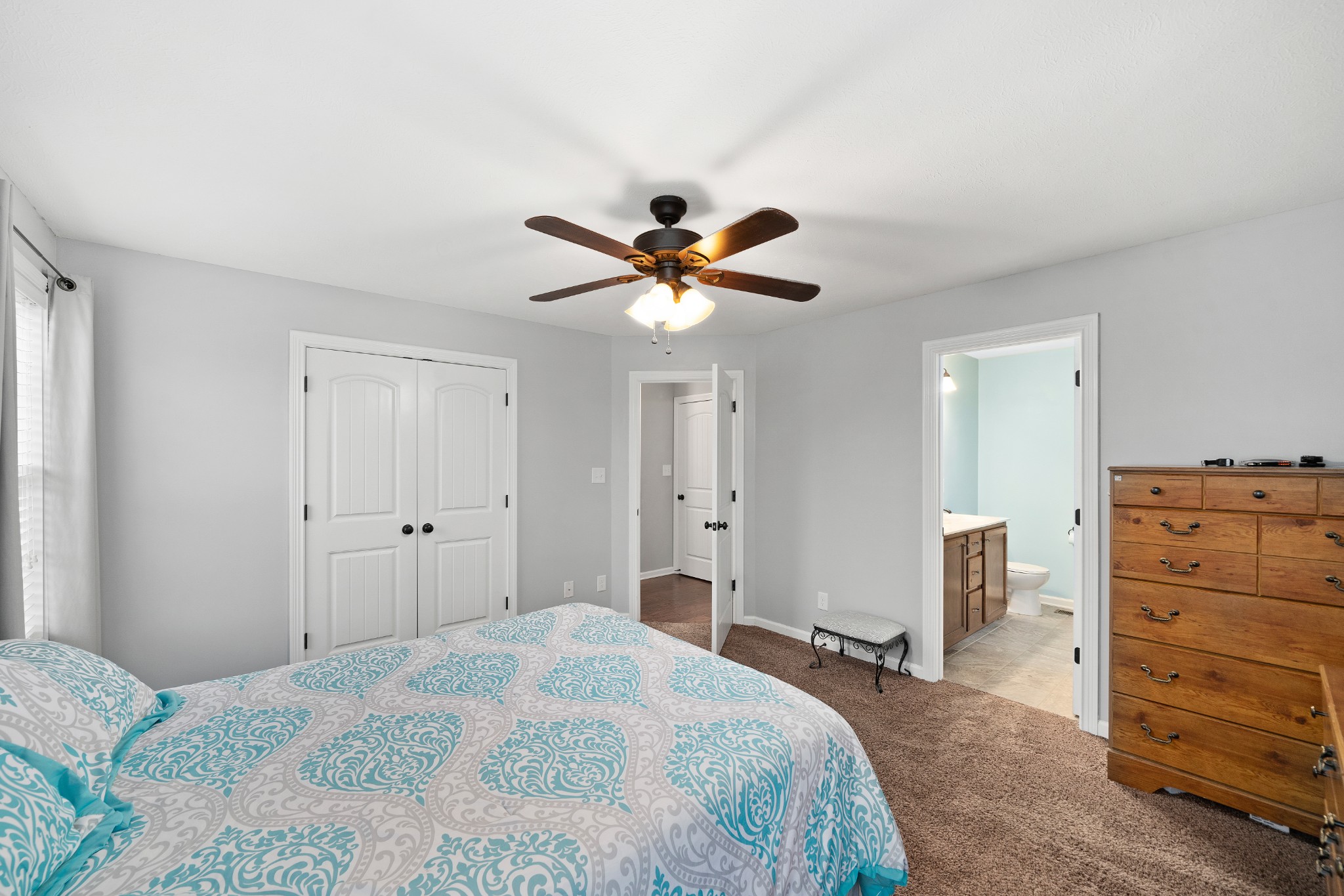 4218 Station Road Cunningham, TN 37052 - Photo 18 of 32 a bedroom with a bed and a ceiling fan