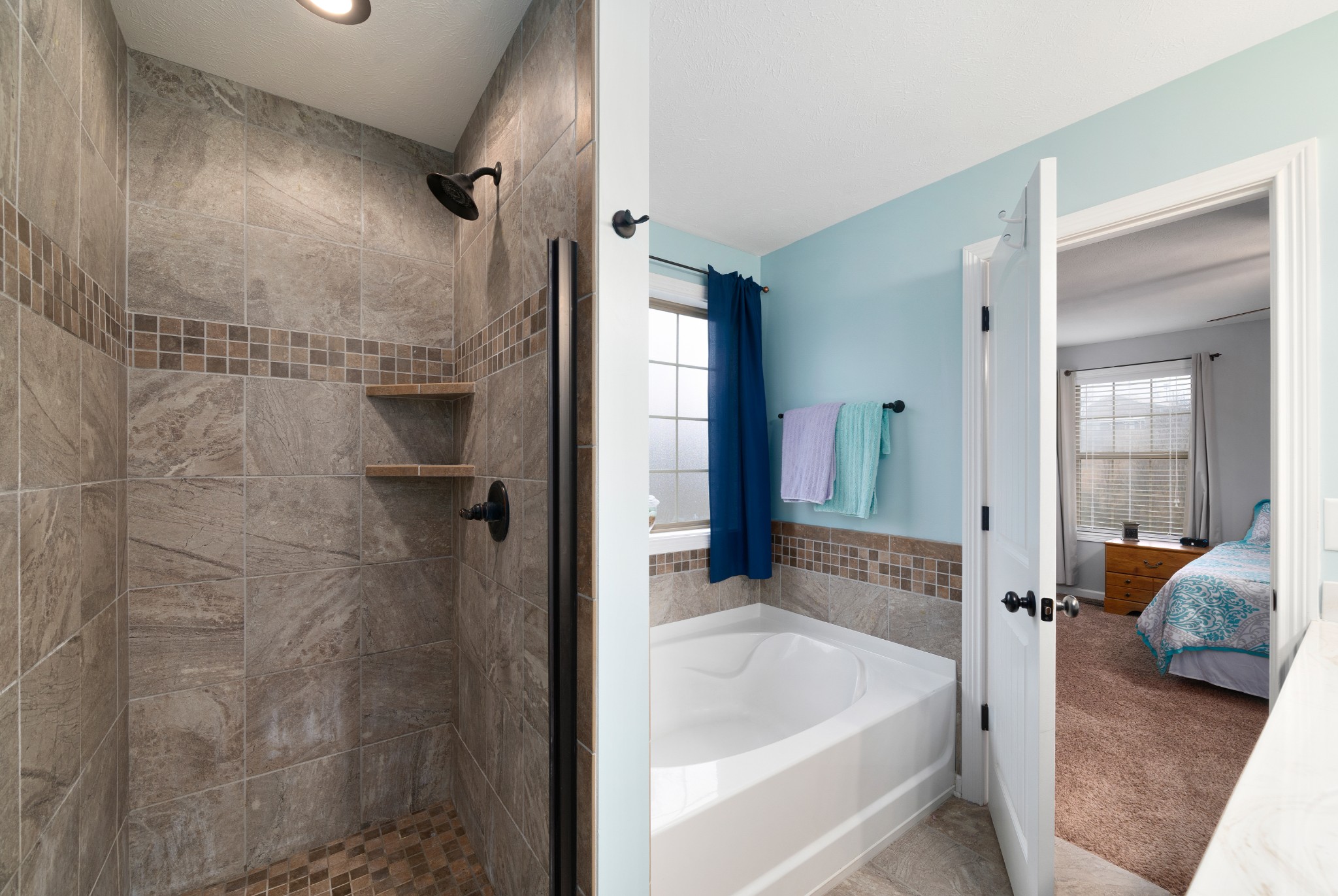 4218 Station Road Cunningham, TN 37052 - Photo 19 of 32 a en suite bathroom with a sink and shower