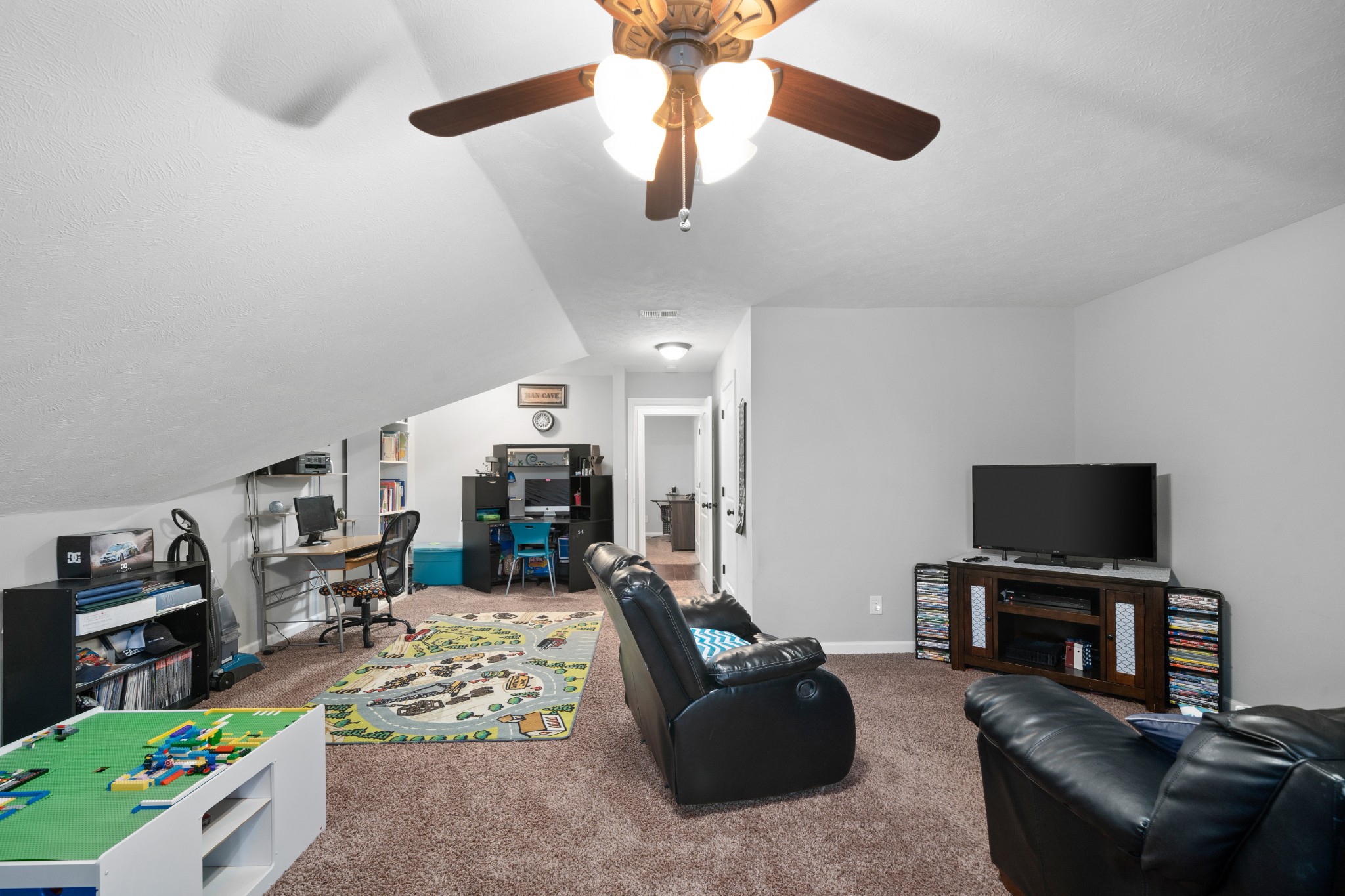 4218 Station Road Cunningham, TN 37052 - Photo 21 of 32 a living room with furniture and a flat screen tv with kitchen view