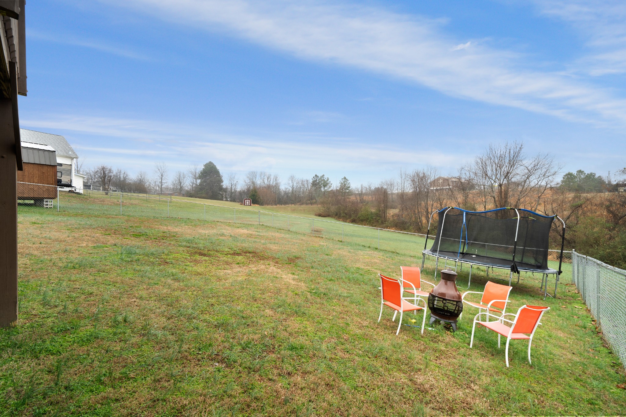 4218 Station Road Cunningham, TN 37052 - Photo 28 of 32 a view of a big yard with a table and chairs
