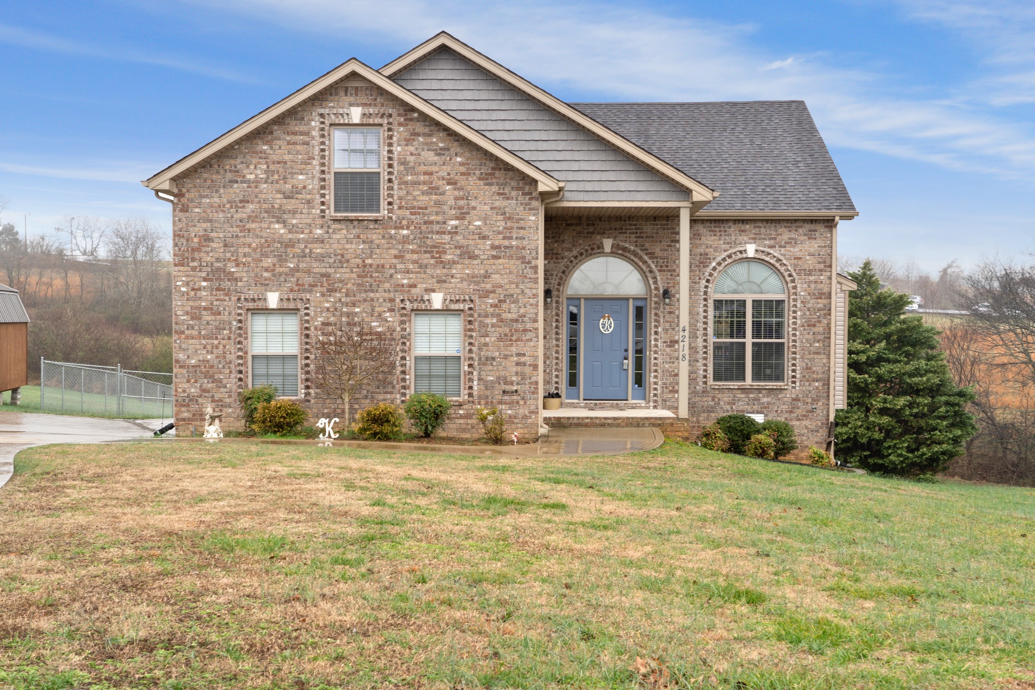 4218 Station Road Cunningham, TN 37052 - Photo 4 of 32 a front view of a house with a yard