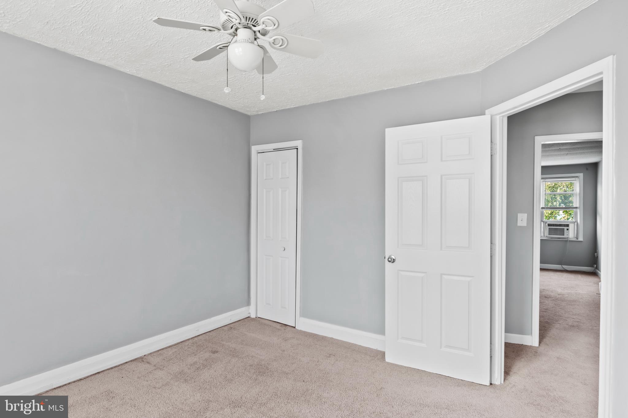 1411 Filbert Street, Unit 2 Curtis Bay, MD 21226 - Photo 12 of 13 an empty room with fan