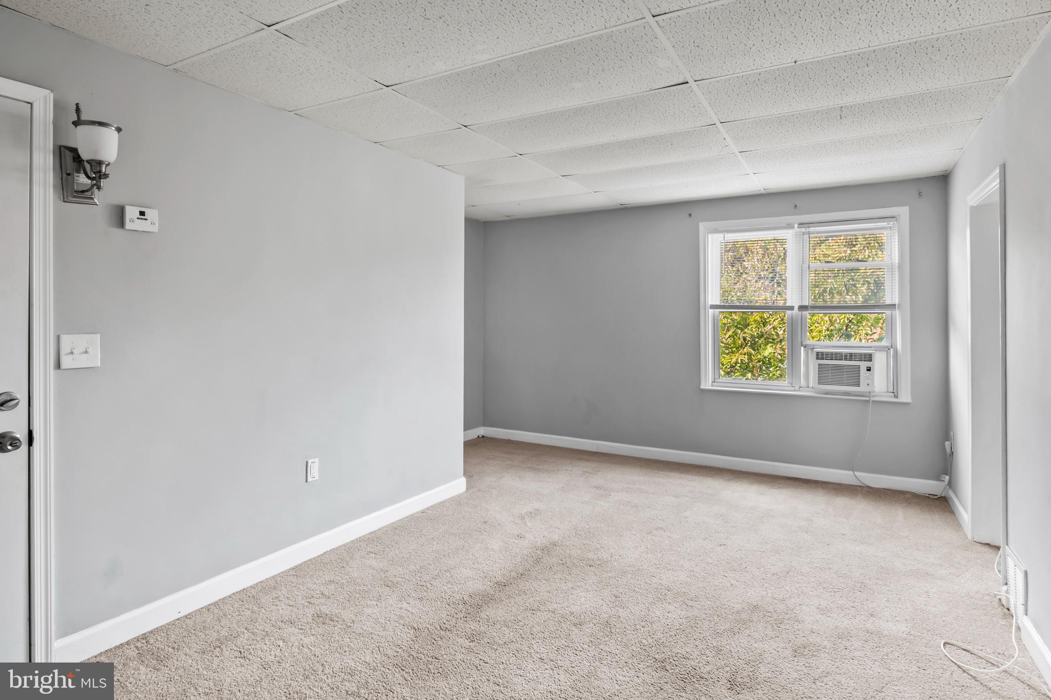 1411 Filbert Street, Unit 2 Curtis Bay, MD 21226 - Photo 2 of 13 an empty room with windows