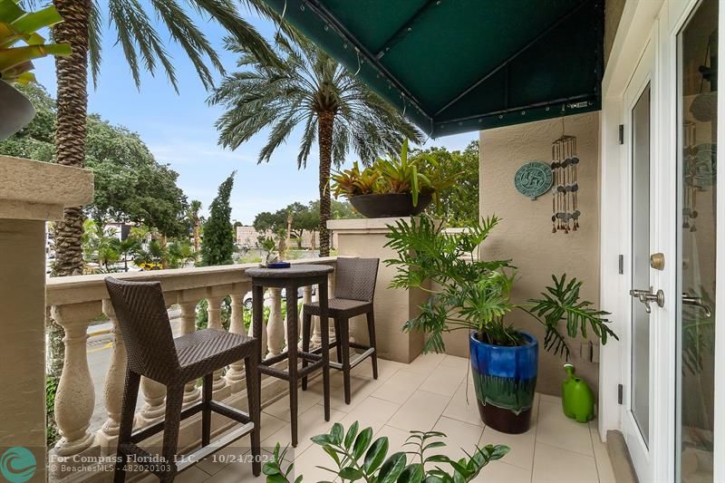 301 Tarpon Drive Fort Lauderdale, FL 33301 - Photo 16 of 21 a view of a patio with table and chairs and potted plants