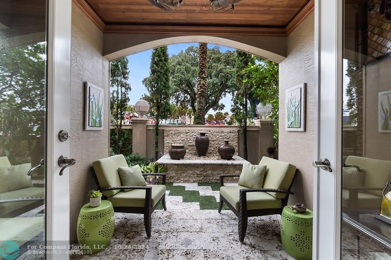 301 Tarpon Drive Fort Lauderdale, FL 33301 - Photo 17 of 21 a view of patio with table and chairs and potted plants
