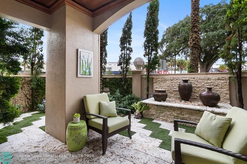 301 Tarpon Drive Fort Lauderdale, FL 33301 - Photo 18 of 21 a view of a patio with couches table and chairs and potted plants