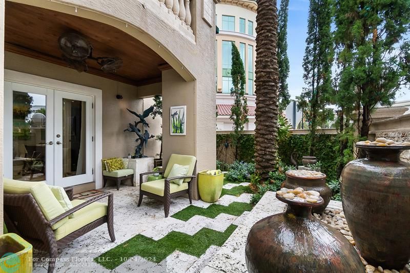301 Tarpon Drive Fort Lauderdale, FL 33301 - Photo 19 of 21 a view of a patio with couches table and chairs and potted plants