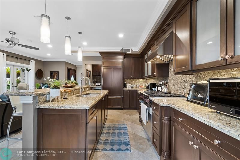 301 Tarpon Drive Fort Lauderdale, FL 33301 - Photo 5 of 21 a kitchen with stainless steel appliances granite countertop a sink a stove and a wooden floors