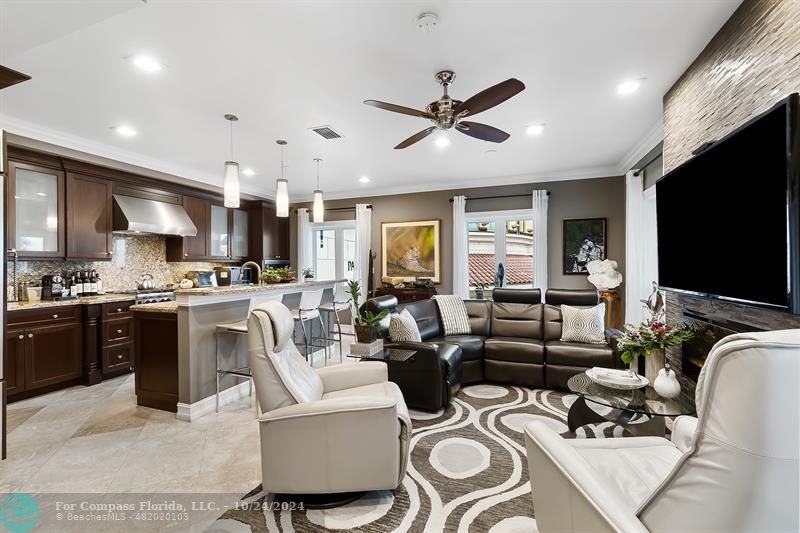 301 Tarpon Drive Fort Lauderdale, FL 33301 - Photo 7 of 21 a living room with furniture kitchen and a flat screen tv