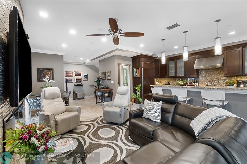 301 Tarpon Drive Fort Lauderdale, FL 33301 - Photo 8 of 21 a living room with furniture kitchen and a chandelier