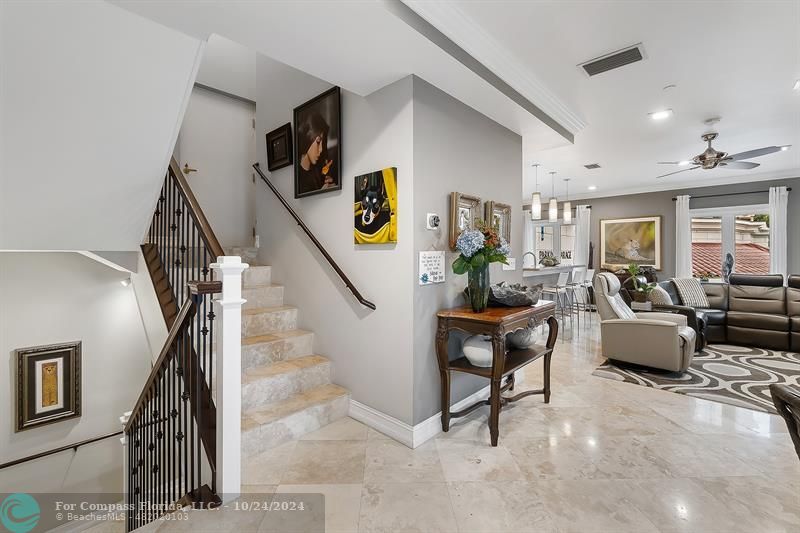 301 Tarpon Drive Fort Lauderdale, FL 33301 - Photo 9 of 21 a living room with couches and kitchen view with wooden floor