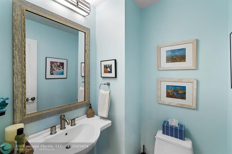 301 Tarpon Drive Fort Lauderdale, FL 33301 - Photo 10 of 21 a bathroom with a sink mirror and a toilet