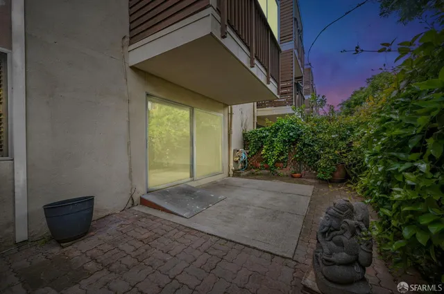 a view of a backyard with potted plants