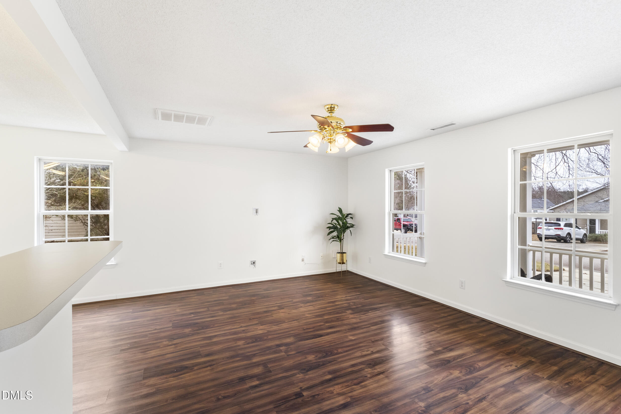 4616 Silverdene Street Raleigh, NC 27616 - Photo 9 of 42 a view of empty room with wooden floor and fan