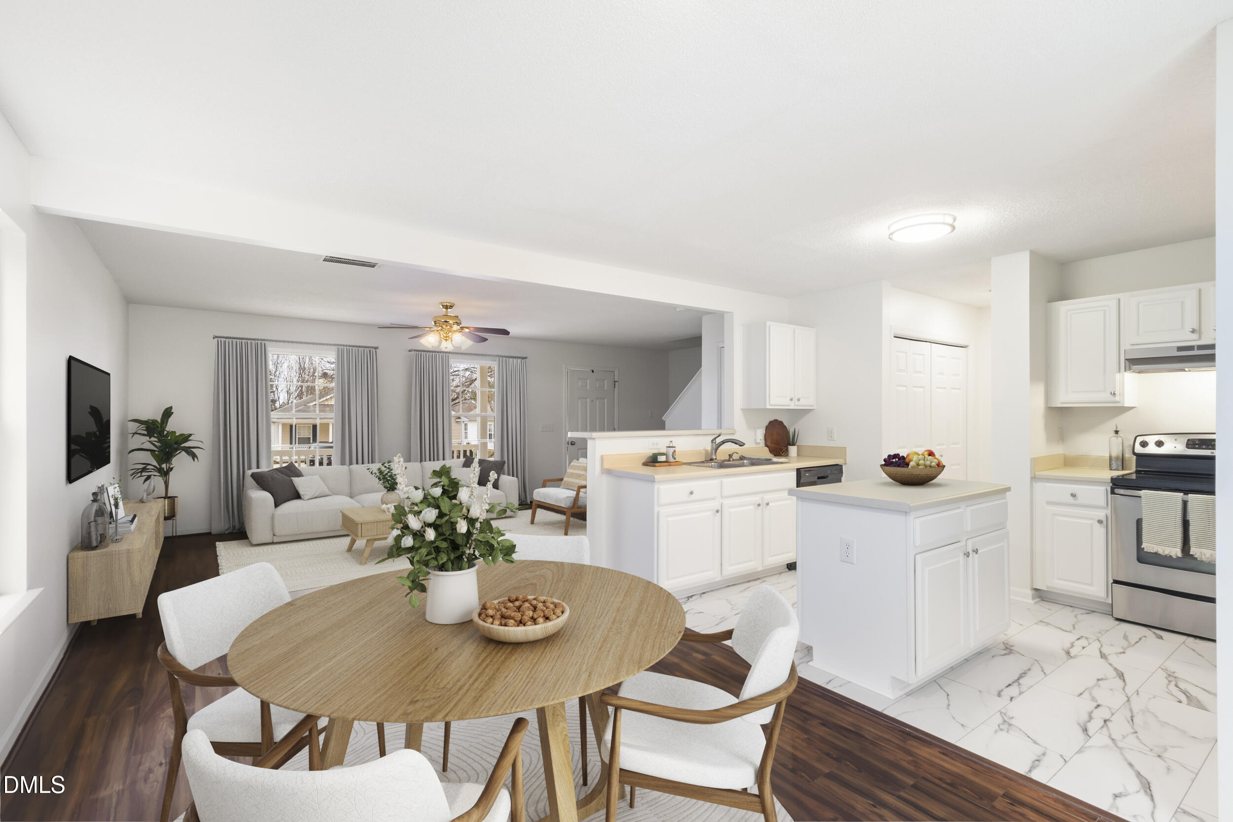 4616 Silverdene Street Raleigh, NC 27616 - Photo 12 of 42 a kitchen with a dining table chairs and white cabinets