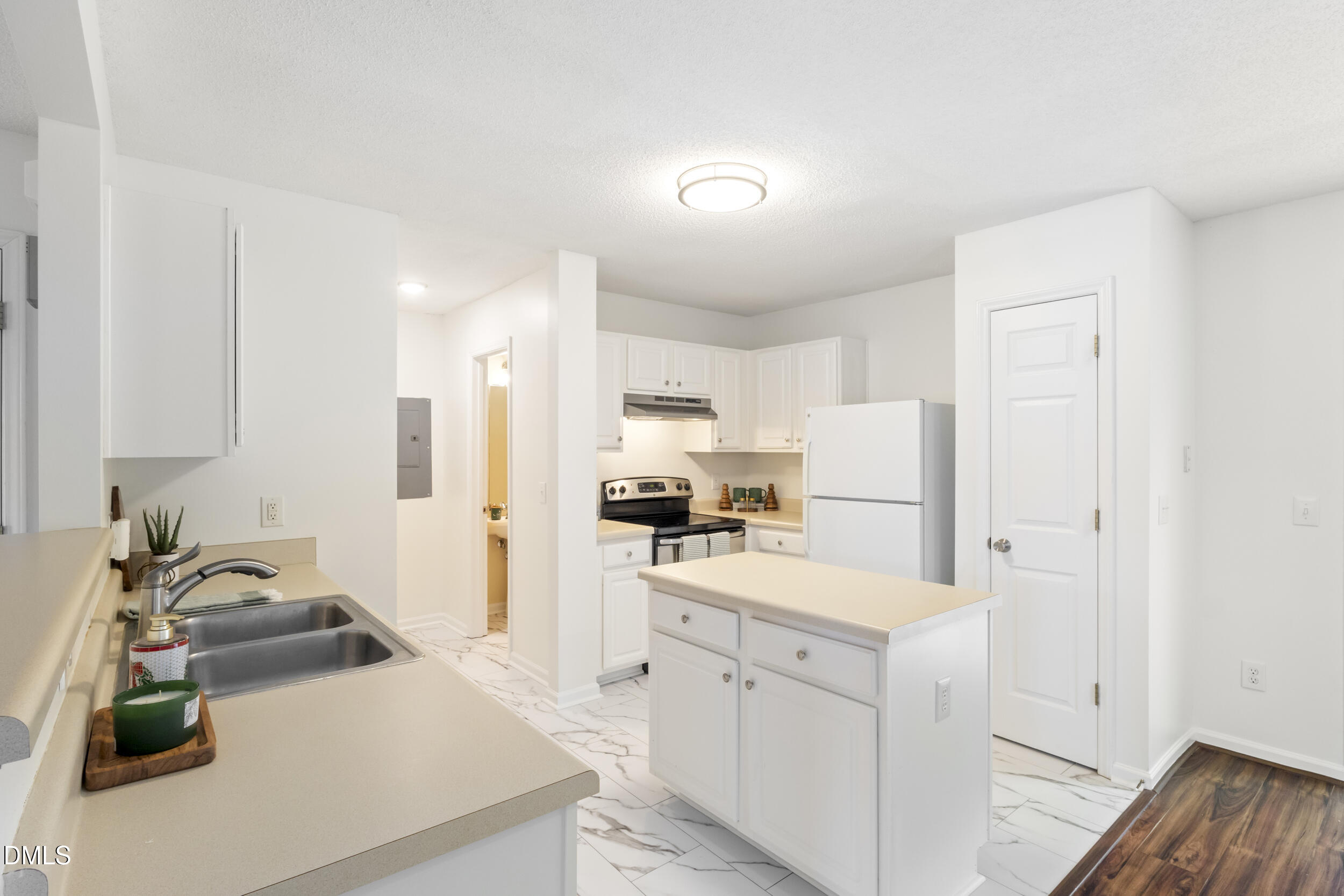 4616 Silverdene Street Raleigh, NC 27616 - Photo 15 of 42 a kitchen with a sink stove and refrigerator