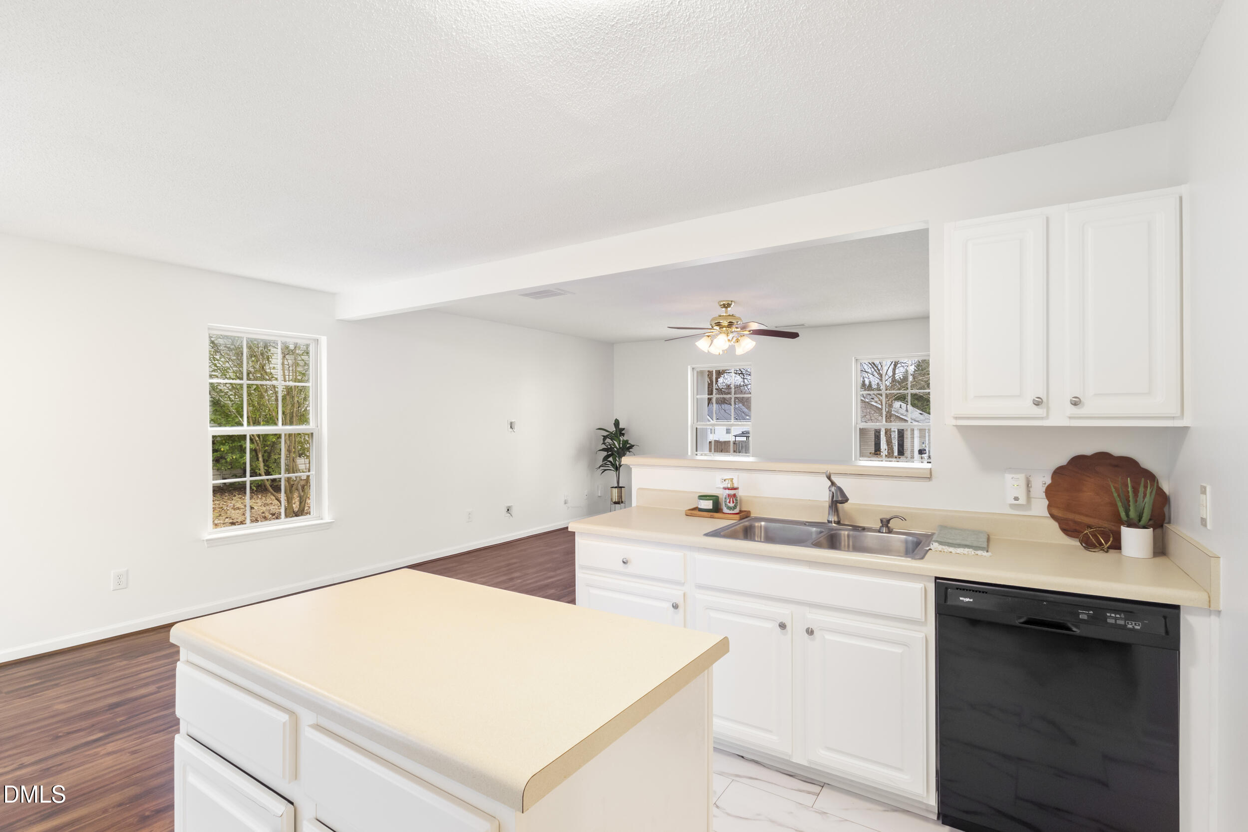 4616 Silverdene Street Raleigh, NC 27616 - Photo 16 of 42 a kitchen with a sink stove and cabinets