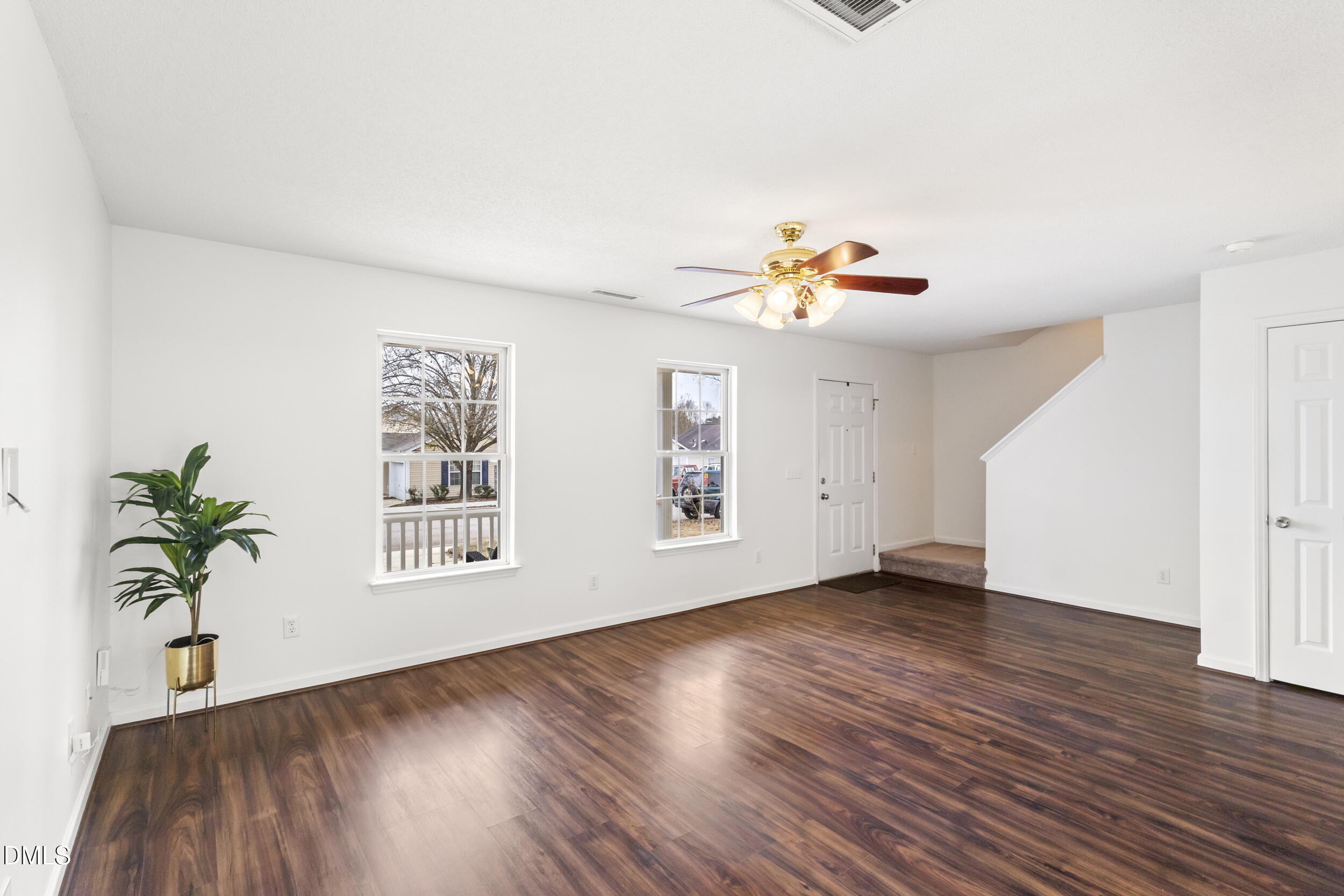 4616 Silverdene Street Raleigh, NC 27616 - Photo 17 of 42 a view of an empty room with wooden floor and a window