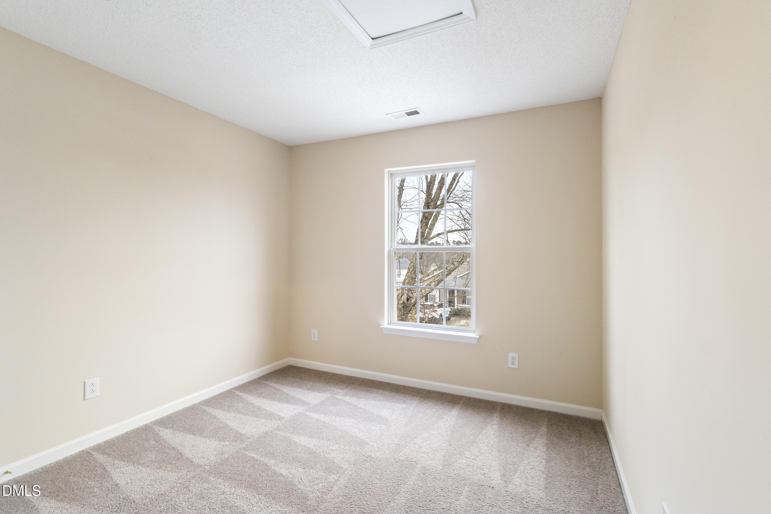 4616 Silverdene Street Raleigh, NC 27616 - Photo 21 of 42 an empty room with windows