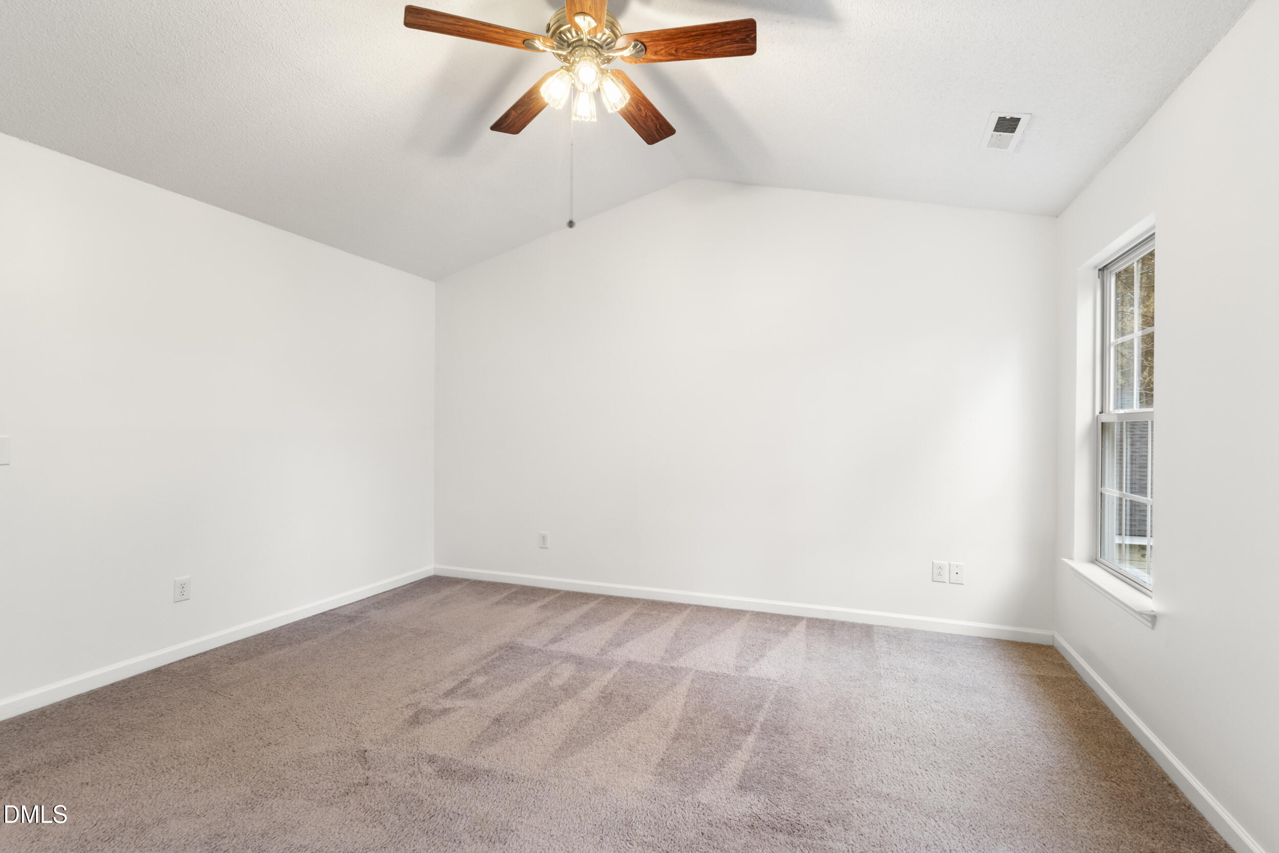 4616 Silverdene Street Raleigh, NC 27616 - Photo 24 of 42 a view of an empty room with a window