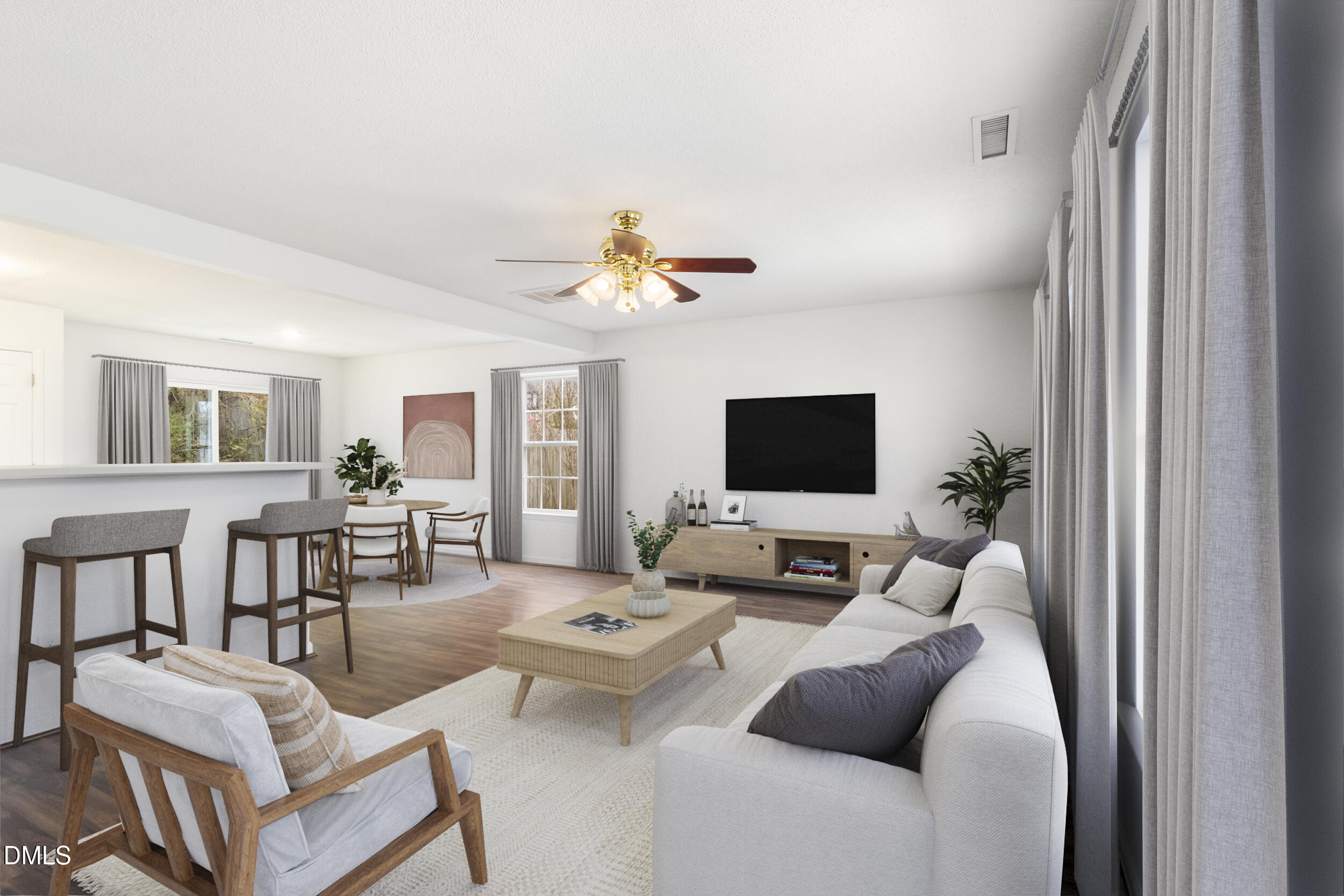 4616 Silverdene Street Raleigh, NC 27616 - Photo 6 of 42 a living room with furniture a flat screen tv and a window