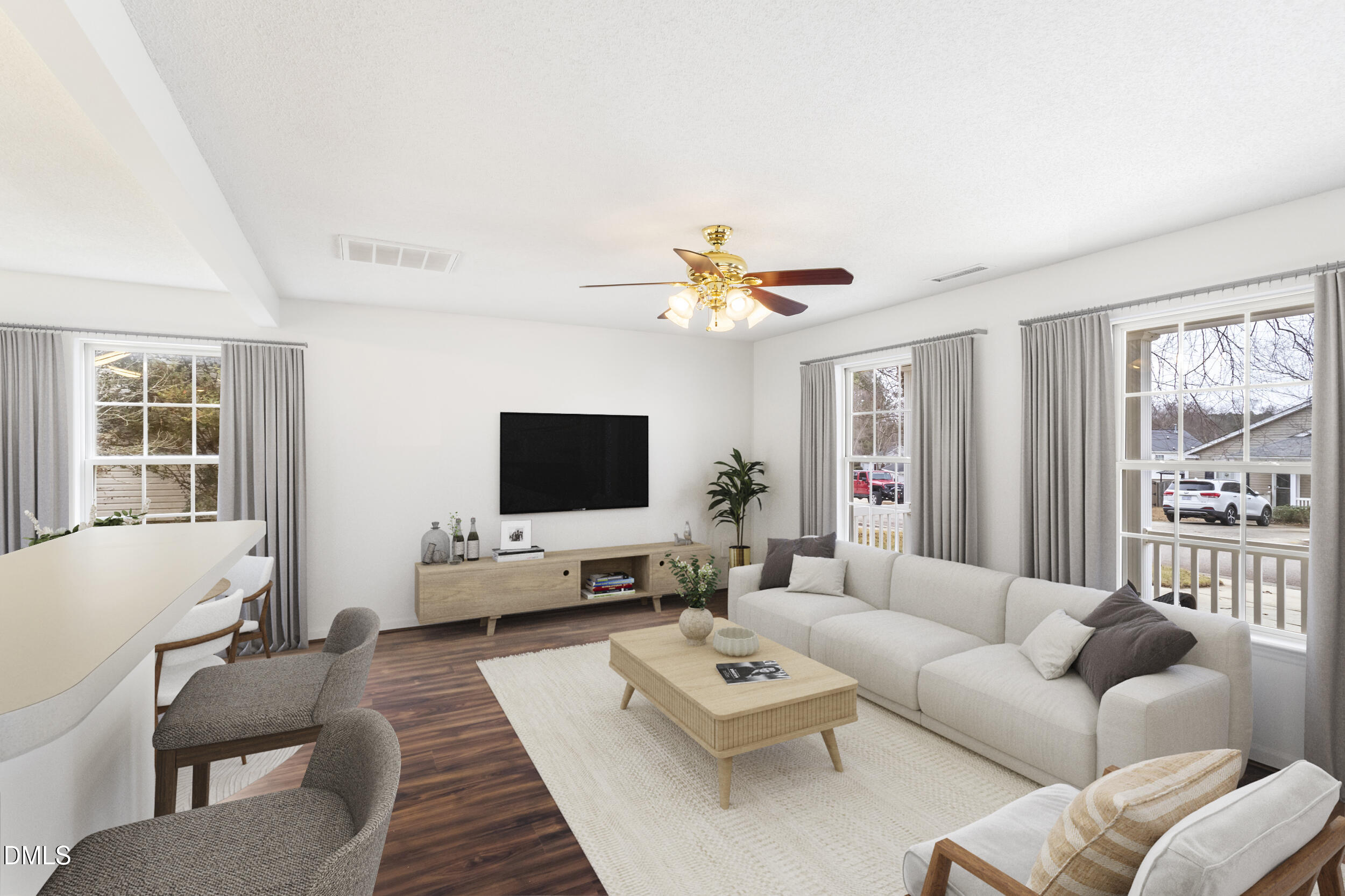 4616 Silverdene Street Raleigh, NC 27616 - Photo 8 of 42 a living room with furniture flat screen tv and a large window