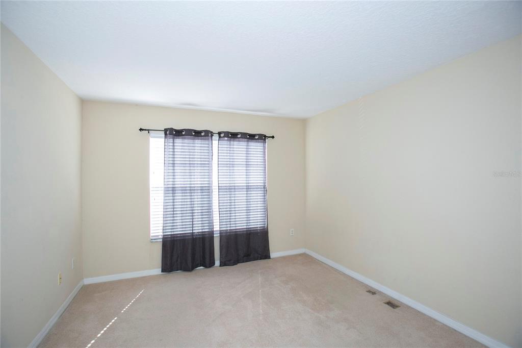 11919 Essington Street New Port Richey, FL 34654 - Photo 19 of 46 an empty room with windows