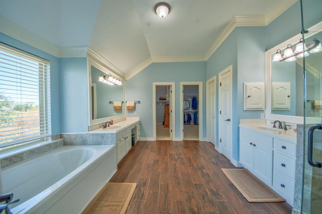 730 East Peninsula Drive Coppell, TX 75019 - Photo 17 of 34 a large white kitchen with a large window