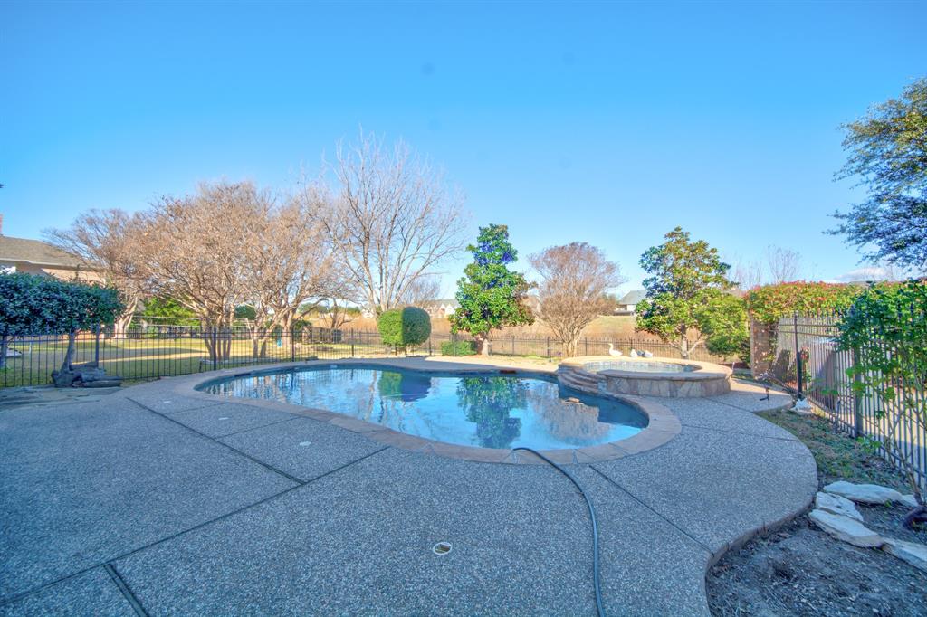 730 East Peninsula Drive Coppell, TX 75019 - Photo 27 of 34 a view of swimming pool with outdoor seating and plants
