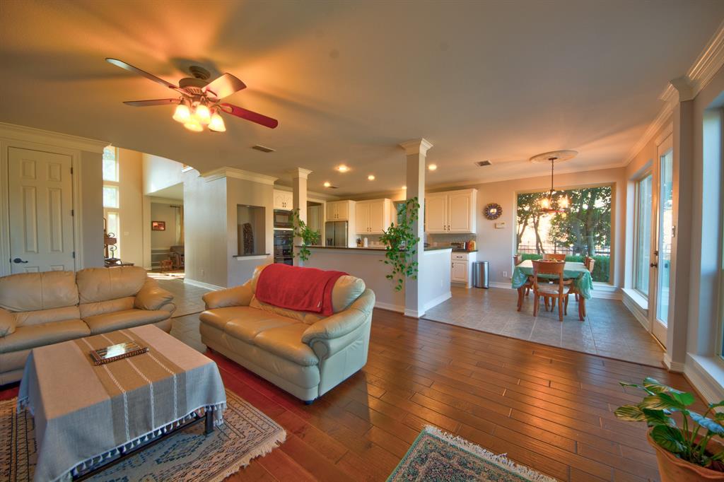 730 East Peninsula Drive Coppell, TX 75019 - Photo 4 of 34 a living room with furniture and a wooden floor