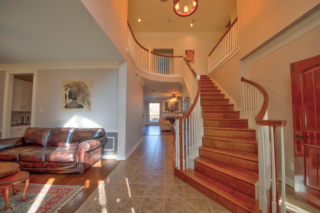 730 East Peninsula Drive Coppell, TX 75019 - Photo 7 of 34 a living room with furniture and a chandelier