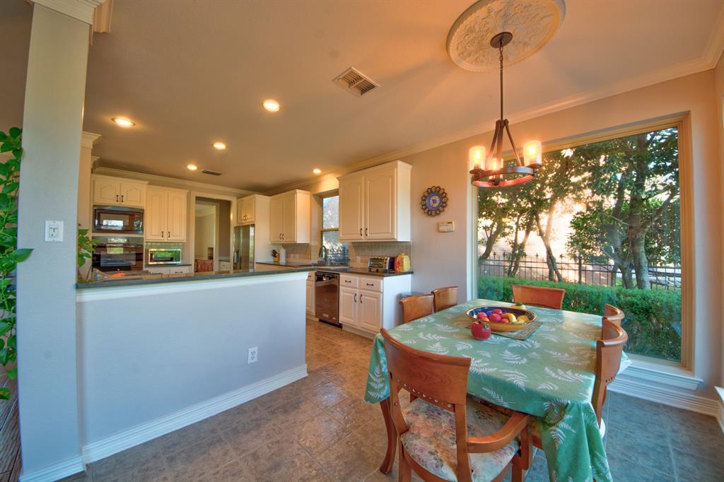 730 East Peninsula Drive Coppell, TX 75019 - Photo 10 of 34 a dining room with furniture and window