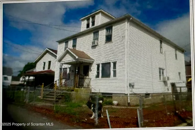 a front view of house with yard