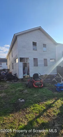 a view of a back yard of the house