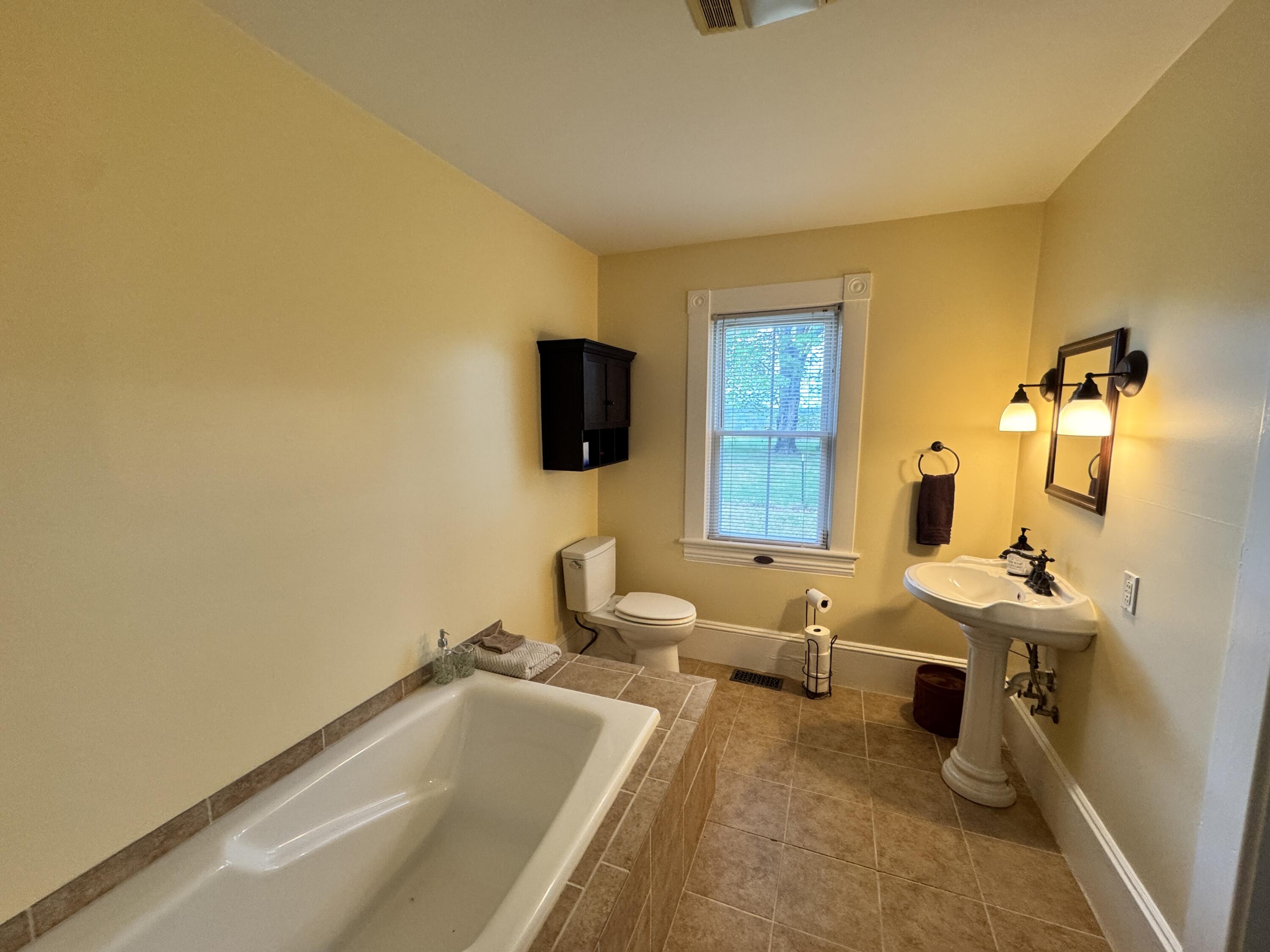 17749 Main Street Buchanan, VA 24066 - Photo 17 of 58 a room with gym equipment and a flat screen tv