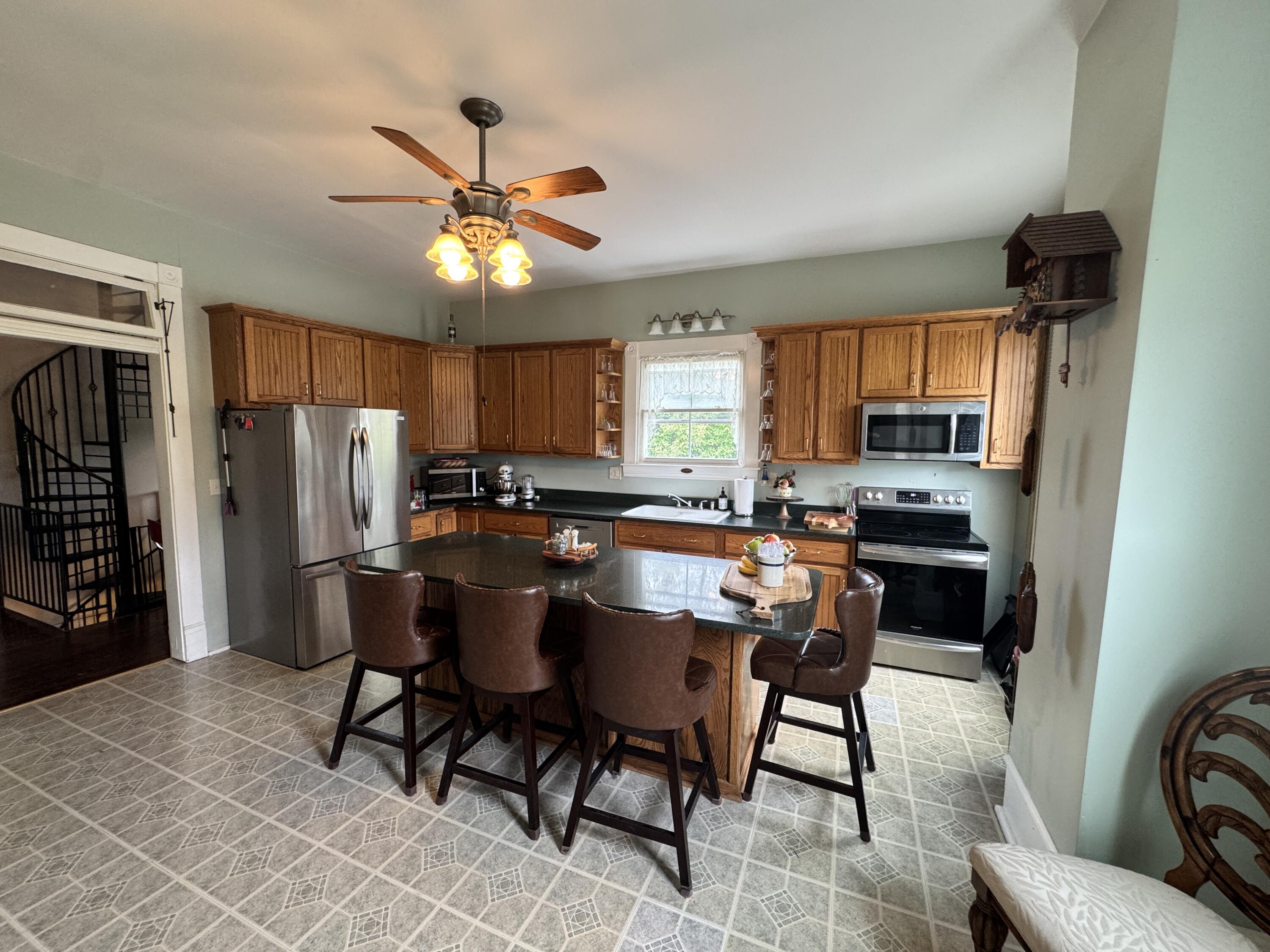17749 Main Street Buchanan, VA 24066 - Photo 23 of 58 a view of kitchen with dining table and chairs
