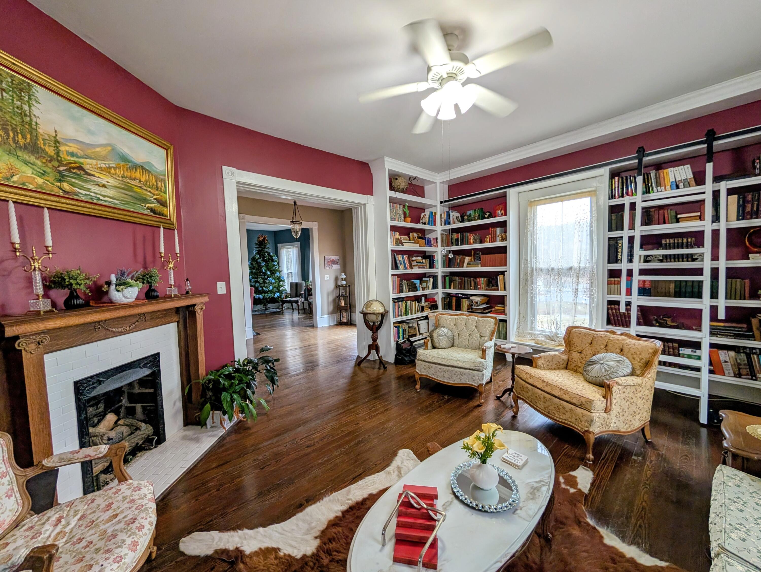 17749 Main Street Buchanan, VA 24066 - Photo 25 of 58 a living room with furniture fireplace and a large window