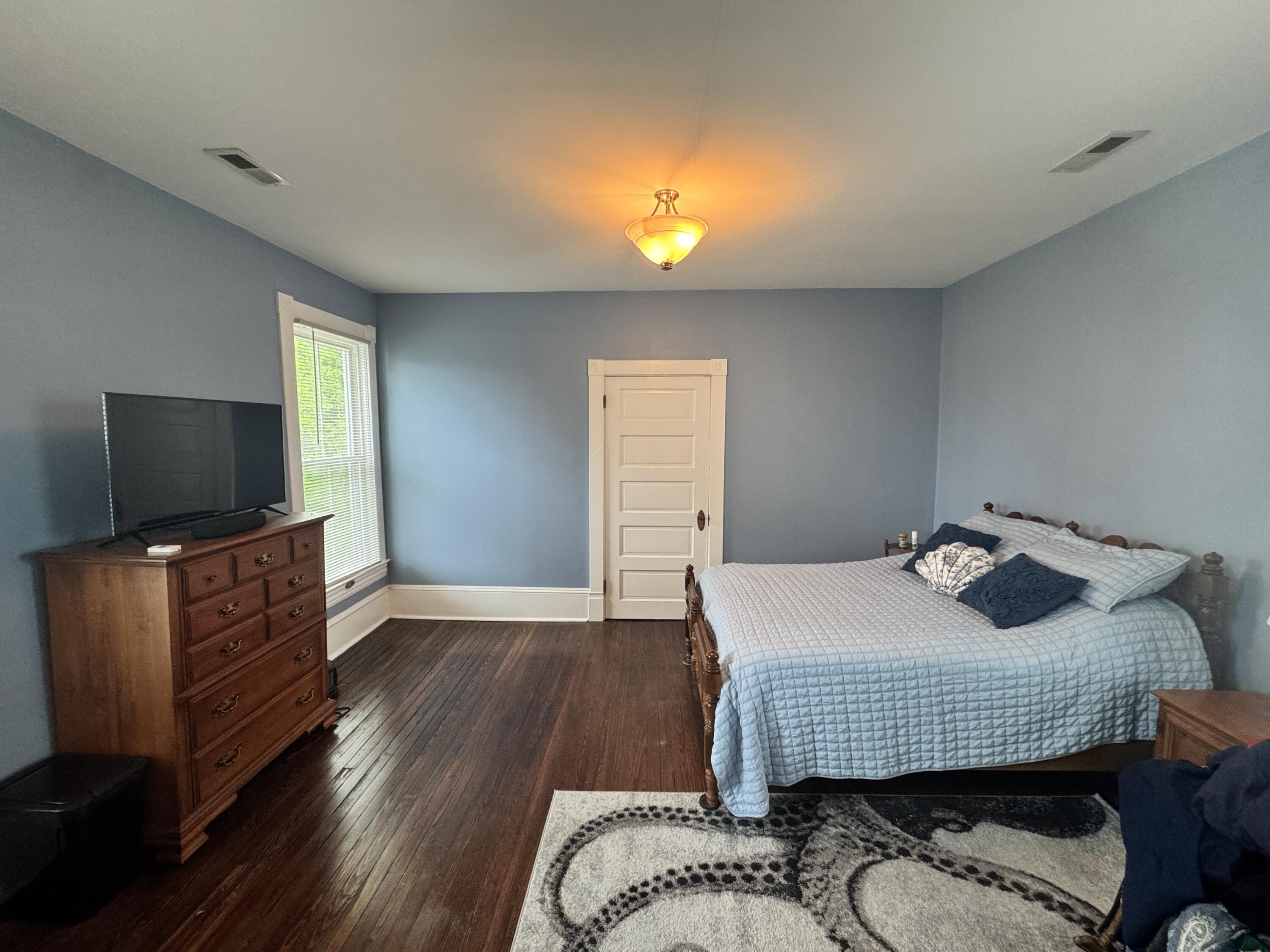 17749 Main Street Buchanan, VA 24066 - Photo 31 of 58 a bedroom with a bed and flat screen tv