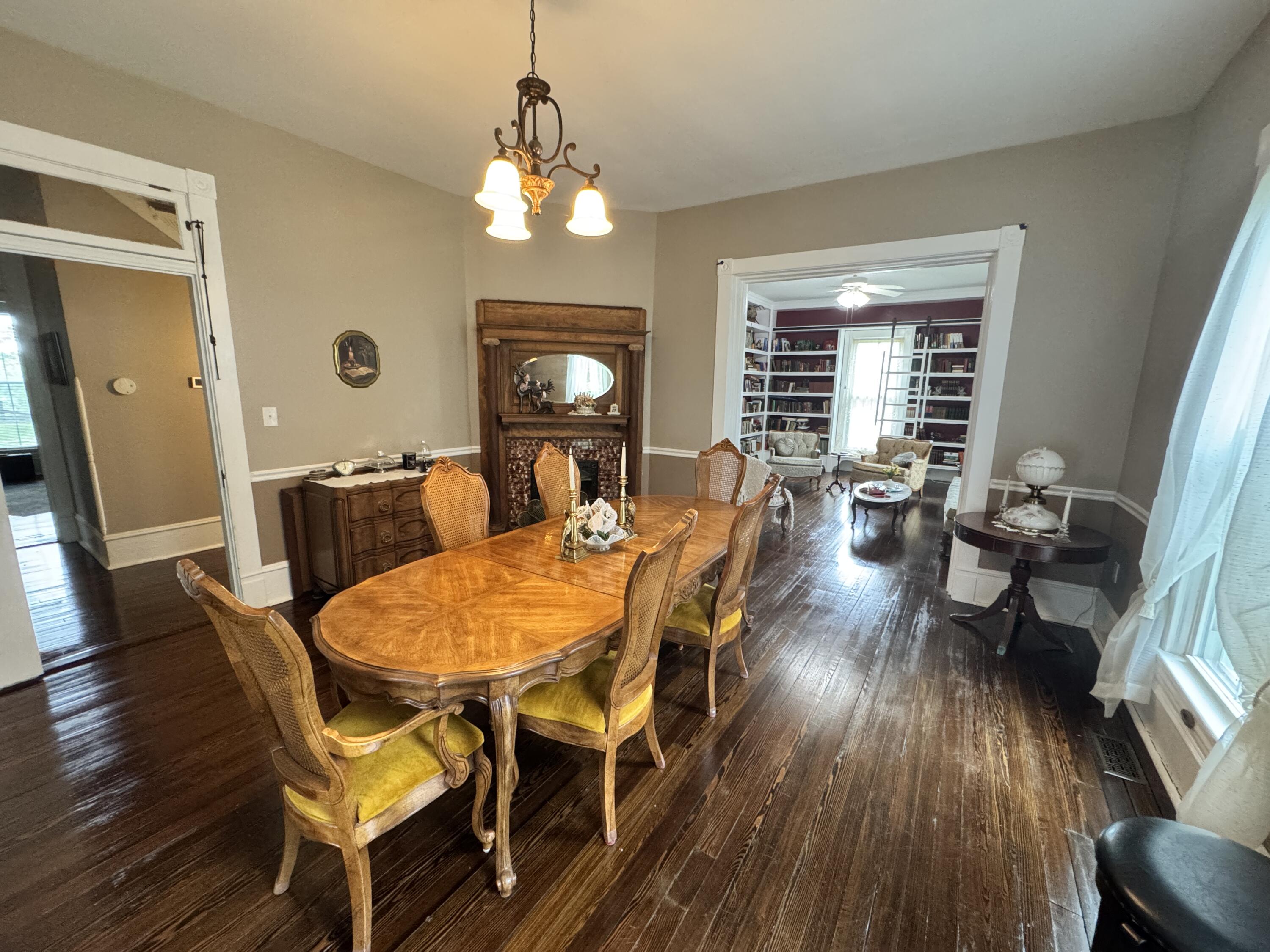 17749 Main Street Buchanan, VA 24066 - Photo 4 of 58 a view of a dining room with furniture a chandelier and wooden floor