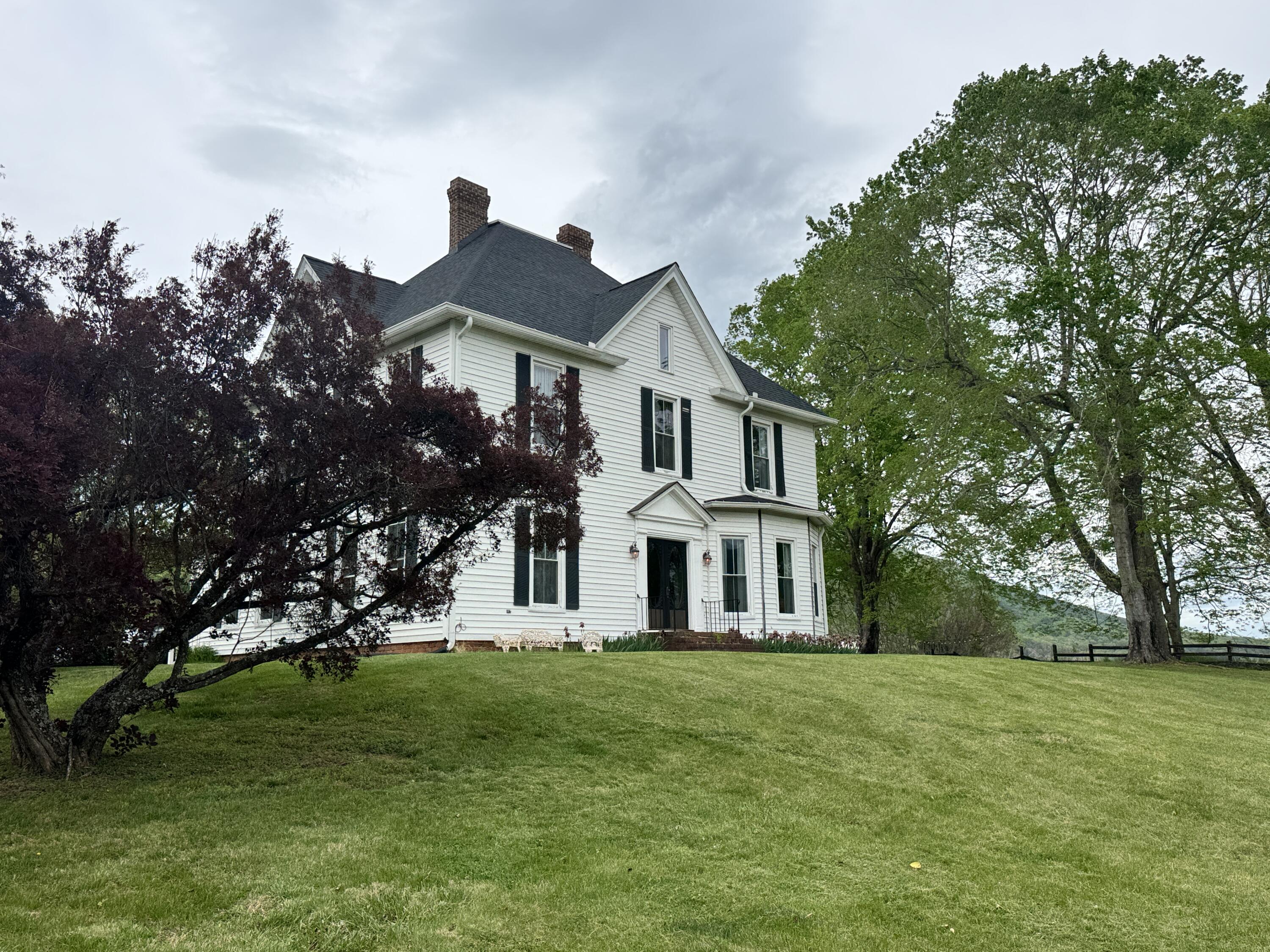 17749 Main Street Buchanan, VA 24066 - Photo 56 of 58 a front view of a house with a garden