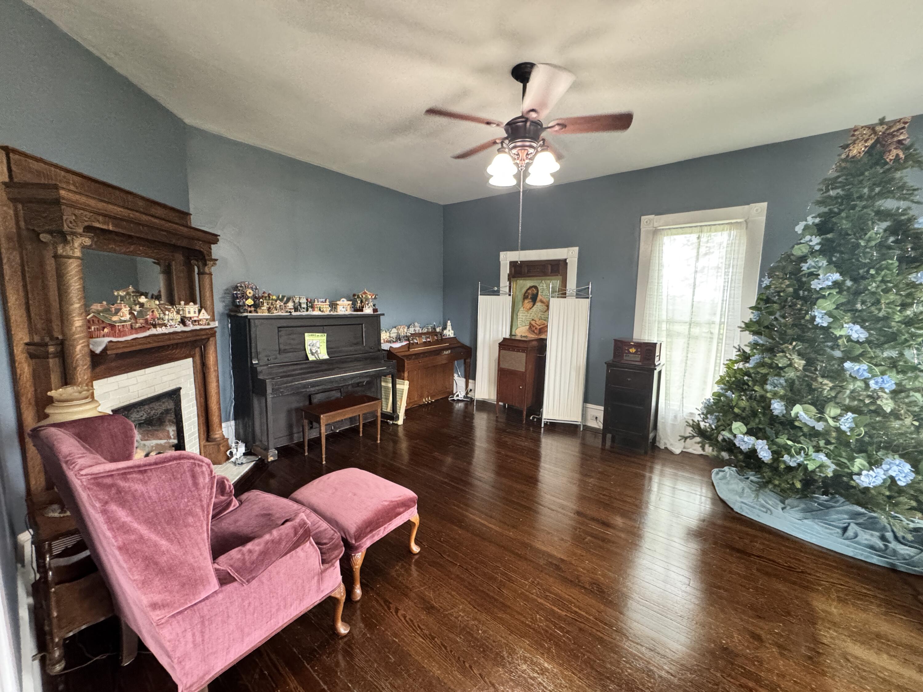17749 Main Street Buchanan, VA 24066 - Photo 7 of 58 a living room with furniture and a fireplace