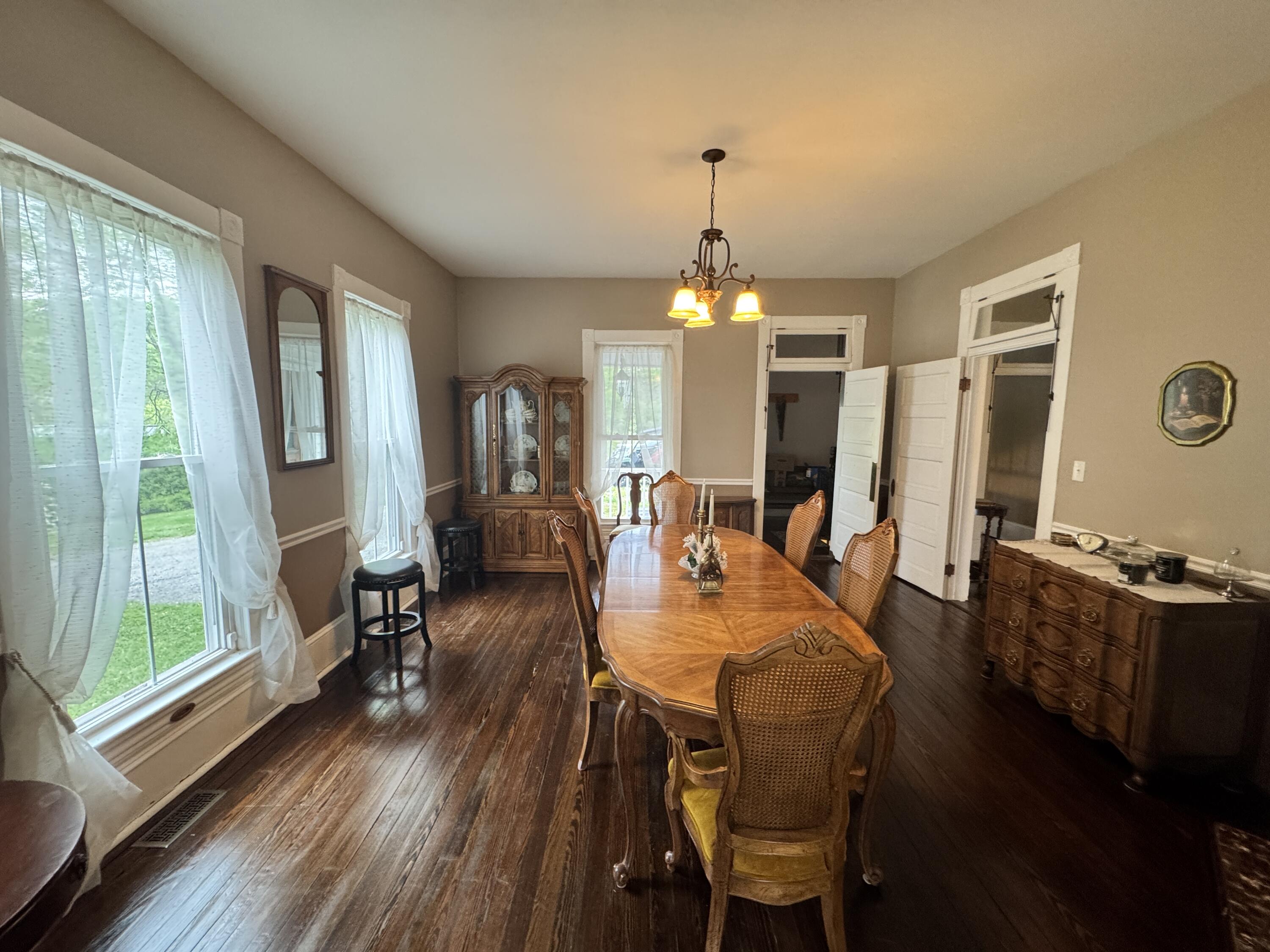 17749 Main Street Buchanan, VA 24066 - Photo 8 of 58 a view of a dining room with furniture window and wooden floor