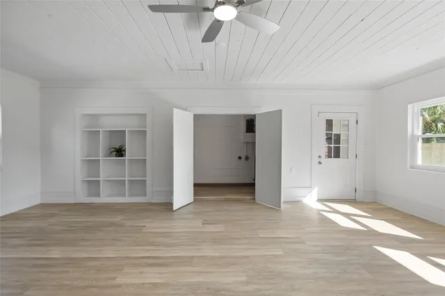 a view of an empty room with a window