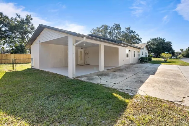 a view of a backyard of the house