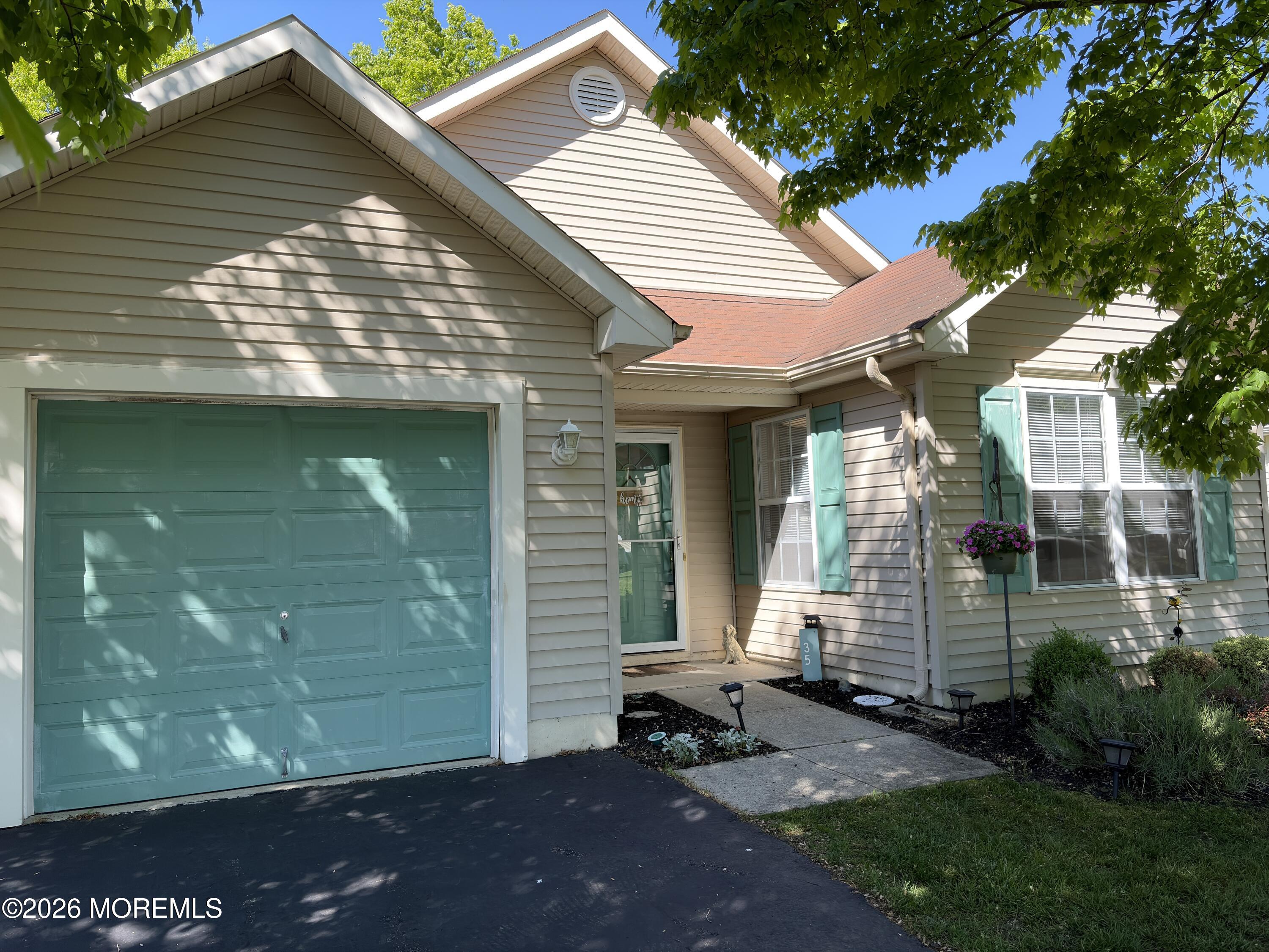 35 Meadows Lane Whiting, NJ 08759 - Photo 2 of 23 a front view of a house with a yard